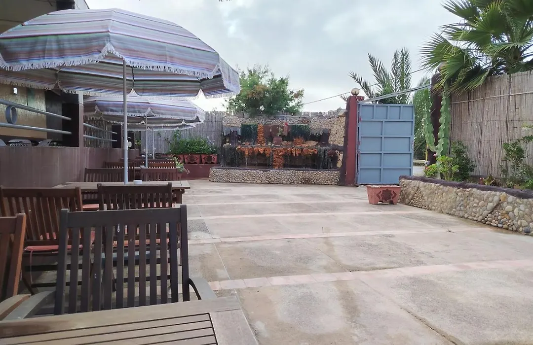 Outdoor terrace dining area at La Bananeraie SurfCamp