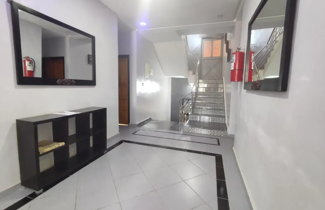 Indoor entrance hallway and staircase at La Bananeraie SurfCamp