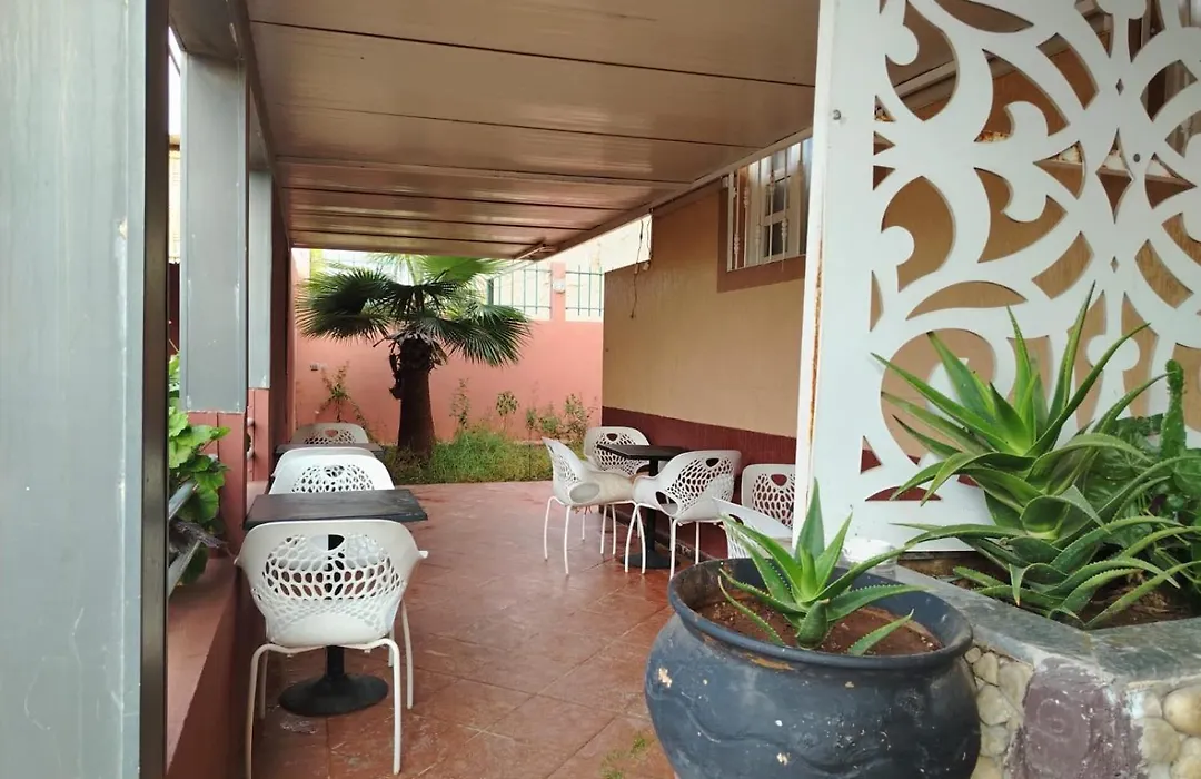Outdoor cafe seating area at La Bananeraie SurfCamp