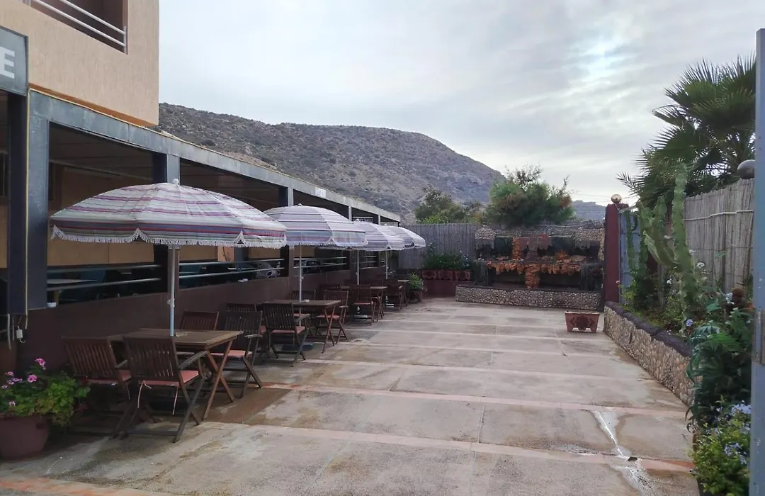 Covered outdoor cafe terrace at La Bananeraie SurfCamp