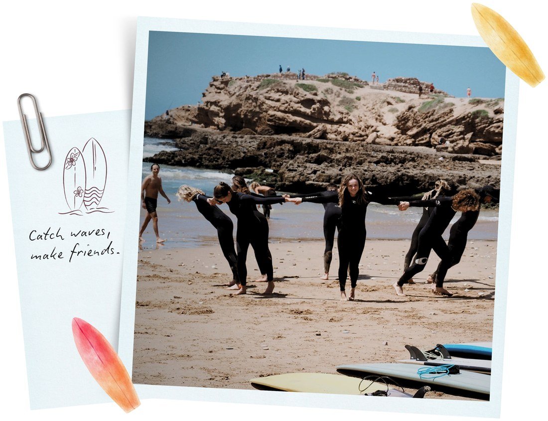 Surf instructors and guests linking arms on the beach near Tamri, Morocco — Ultimate Surf package